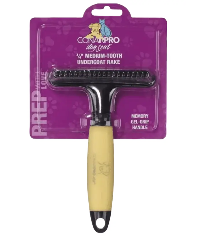 Do Red Fox Labs Shed? Best 3 Ways To Minimize Labrador Shedding A ConairPro Dog Grooming rake with a yellow handle, perfect for a red fox labrador, packaged on a purple card labeled “3/4'' Medium-Tooth Undercoat Rake” and “Memory Gel-Grip Handle,” with paw print designs.